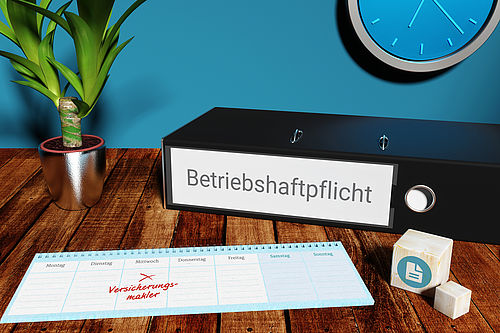 Zu sehen ist ein Tisch, auf dem eine Topfpflanze steht sowie ein Tischkalender und ein Aktenordner liegen. Auf dem Ordner steht "Betriebshaftpflicht".
